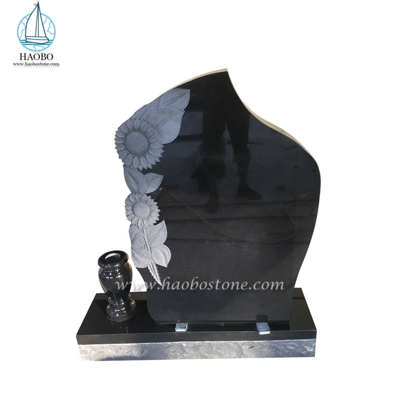 Pierre tombale sculptée de tournesols de pierre tombale de crémation de monument de granit noir
