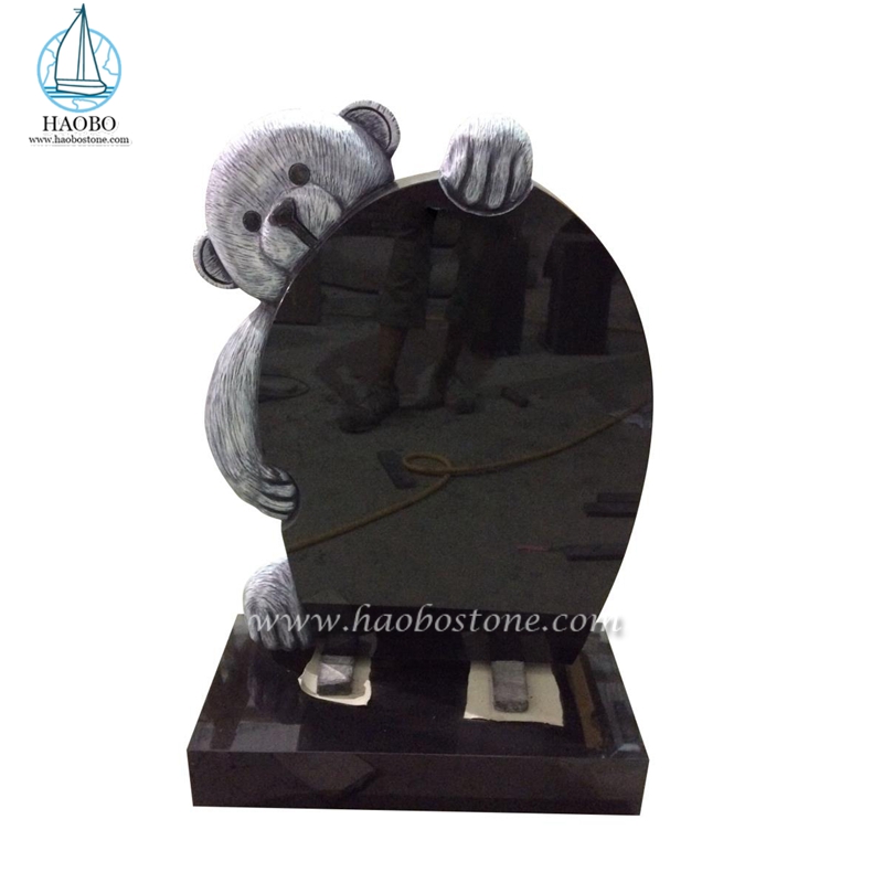 Pierre tombale sculptée d'ours en peluche de dessin animé de granit noir
