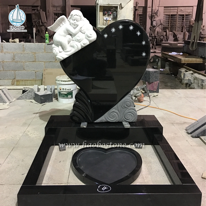Monument de sculpture de bébé ange en forme de coeur en granit noir
