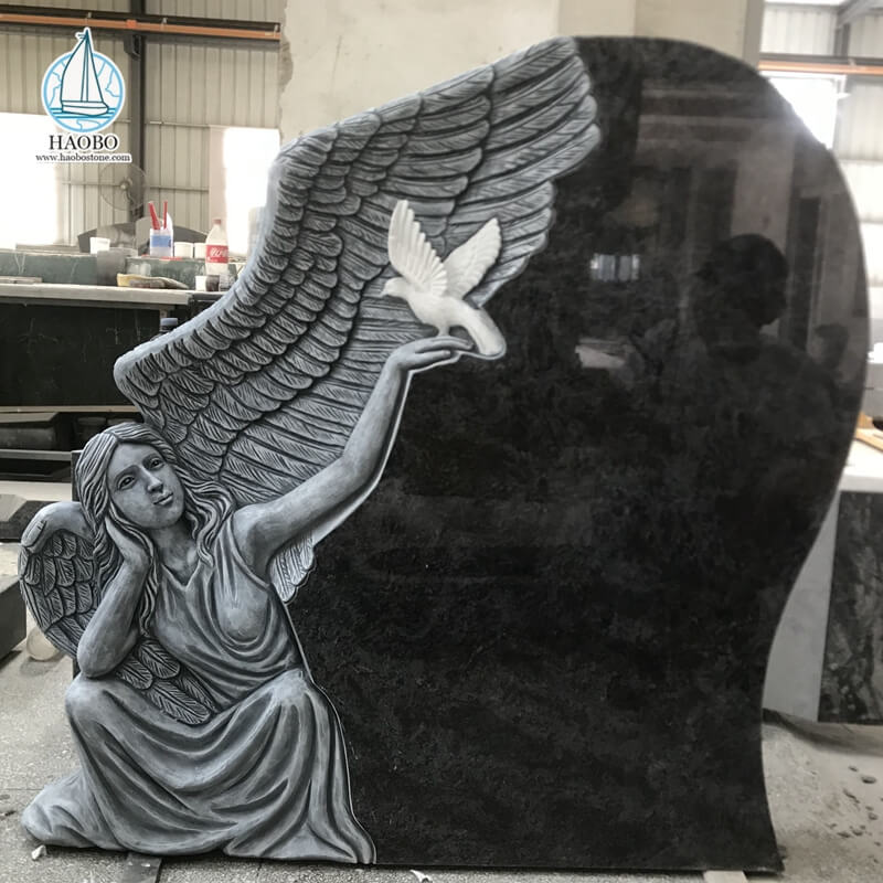 Ange en granit noir avec pierre tombale funéraire sculptée en forme de colombe
